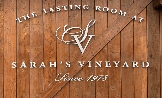 Sarah's vineyard logo on wood
