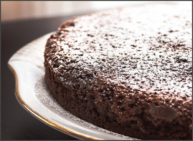 Chocolate Syrah Olive Oil Cake with powdered sugar on top